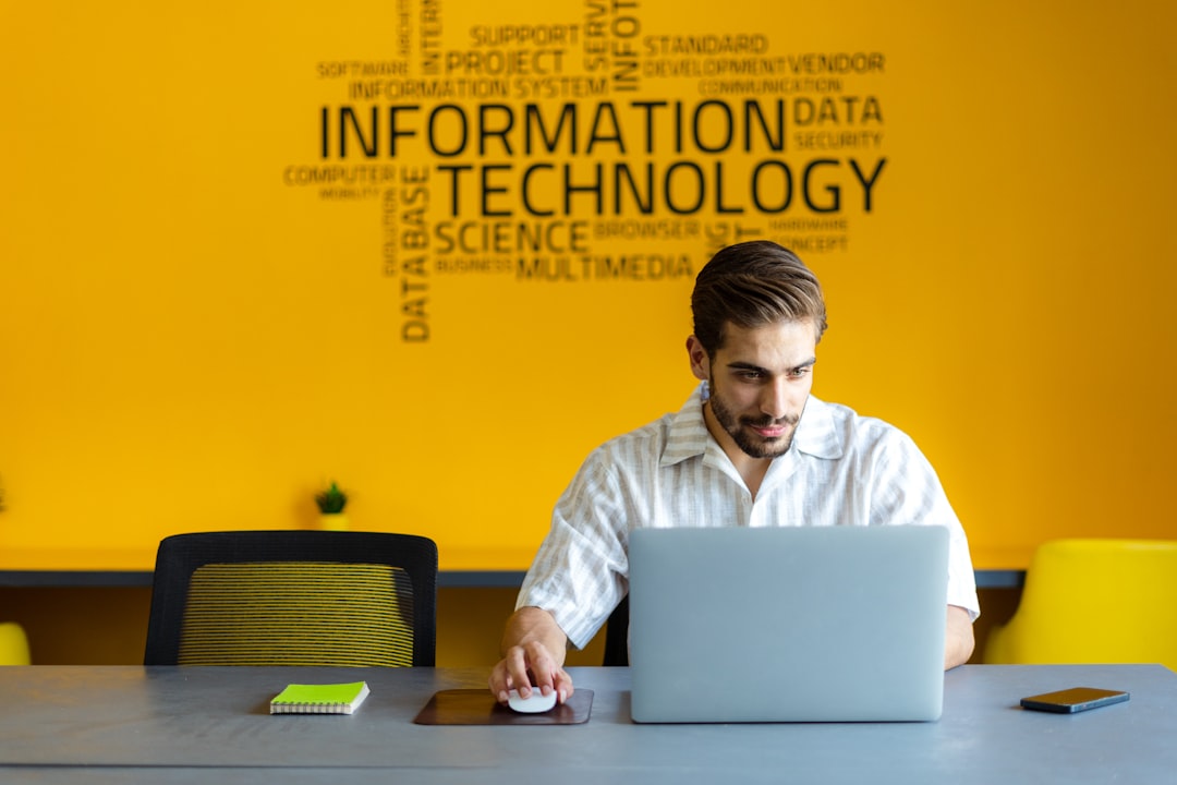Mastering the Password Puzzle: a-man-sitting-in-front-of-a-laptop-computer-lqtw3kswcwg